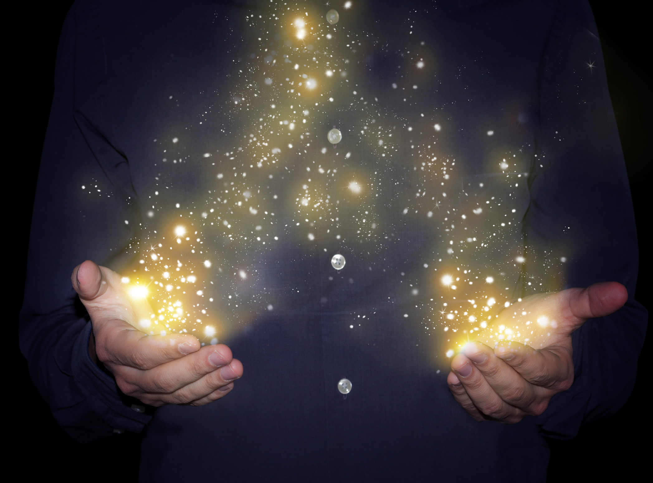 magic sparkles in hands